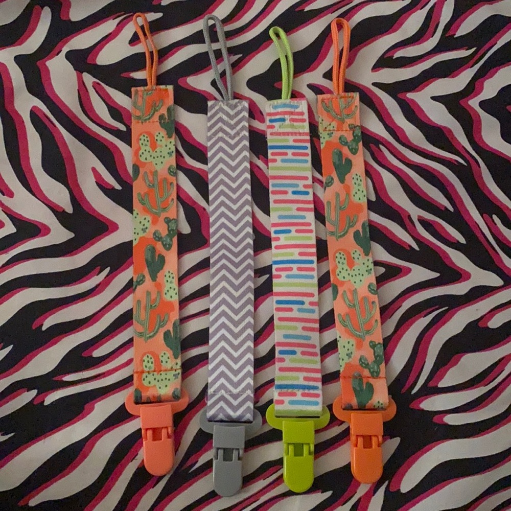 4 Pacifier Holders with a Never Used Bib